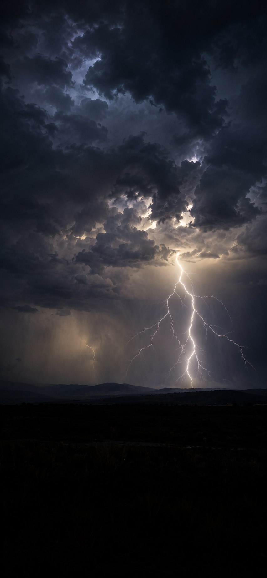 Lightning strike under dark storm clouds shown inside StormSnap